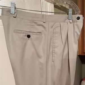Haggar men’s double pleated, cuffed, no iron khaki slacks. Size 32 / 30. Used.